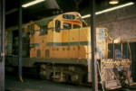 MEC 578, chopnosed GP7, getting some attention in roundhouse,